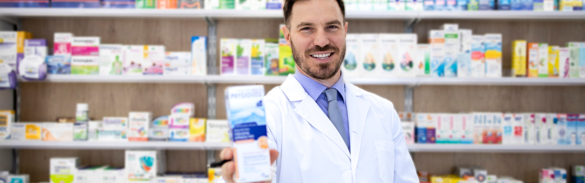 Pharmacist holding a product