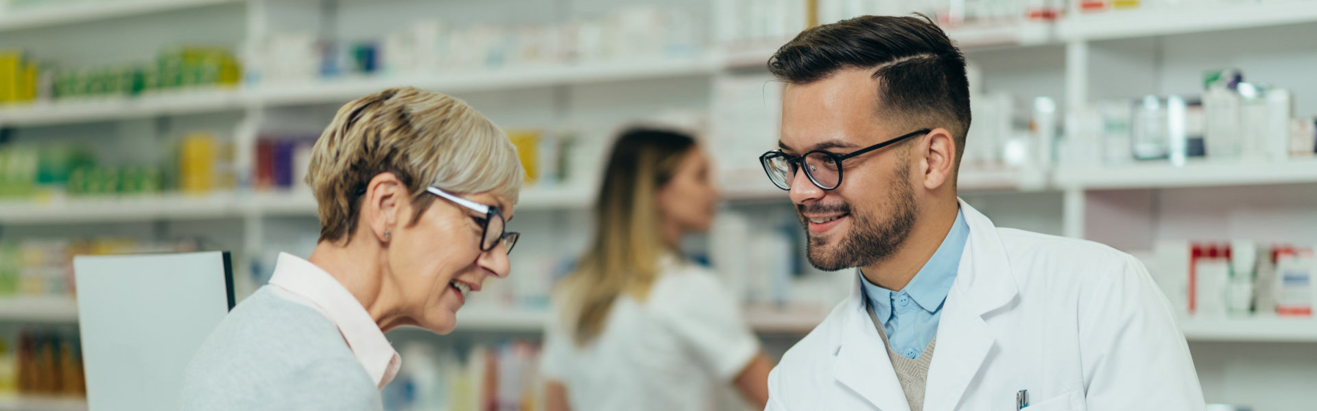 Male Pharmacist talking to the customer