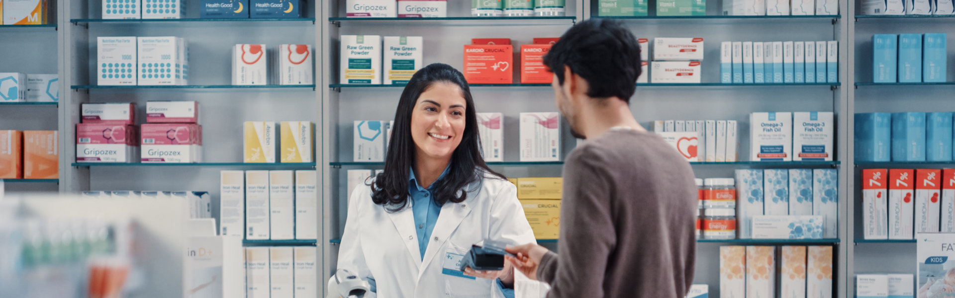 Customer paying at the counter of a pharmacy